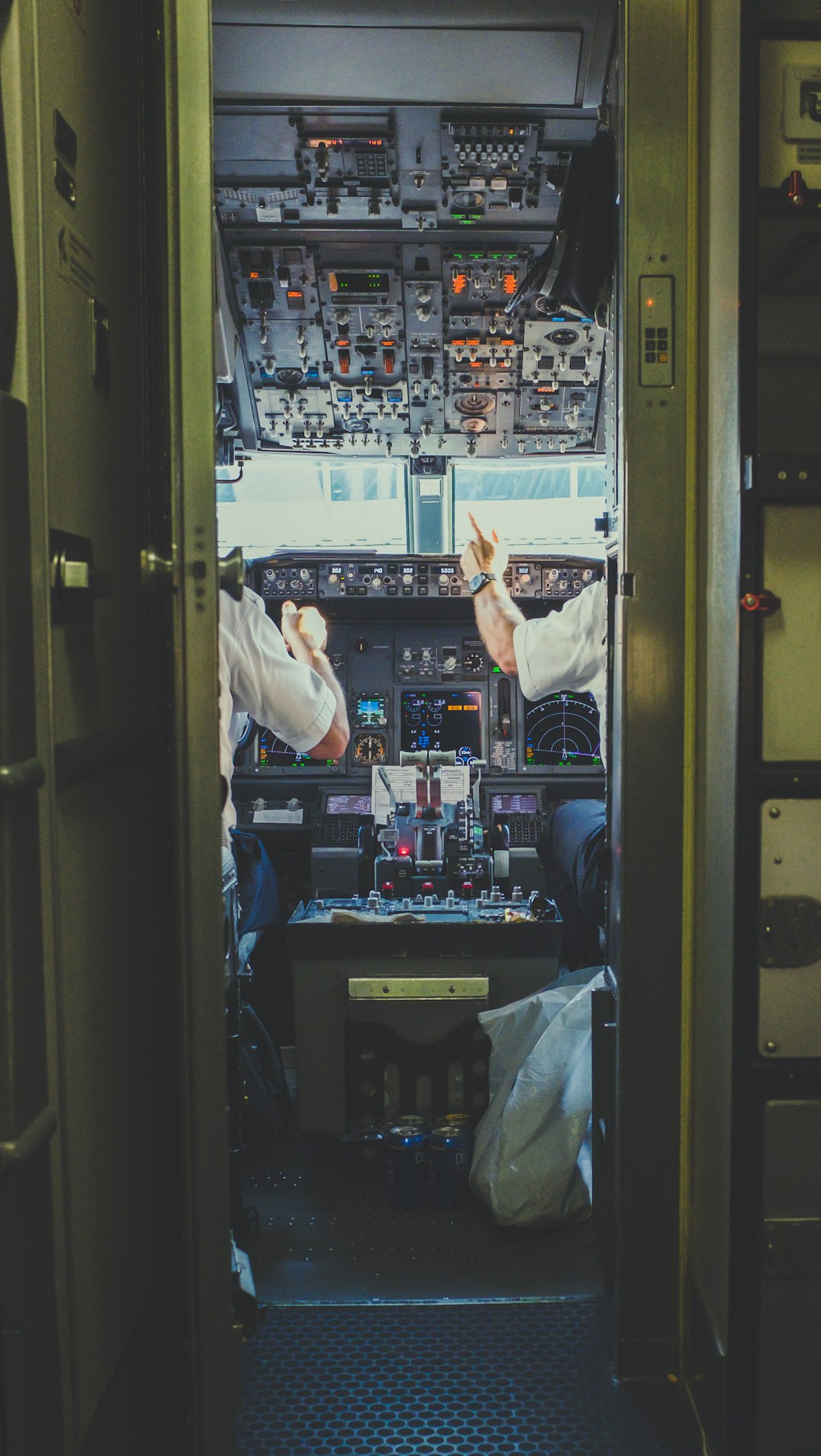 pilot-and-copilot-inside-plane-cockpit-c56y966zoxc